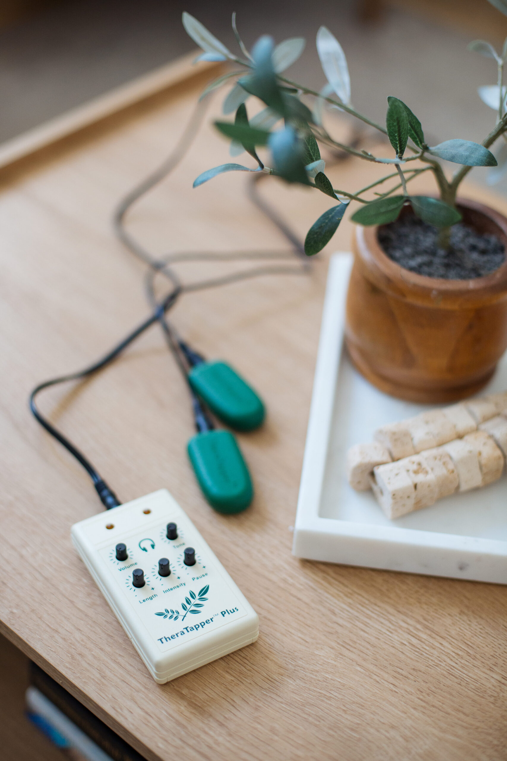 EMDR therapy tappers device on table in calm office setting for EMDR therapy from a therapist in Gilbert, Arizona