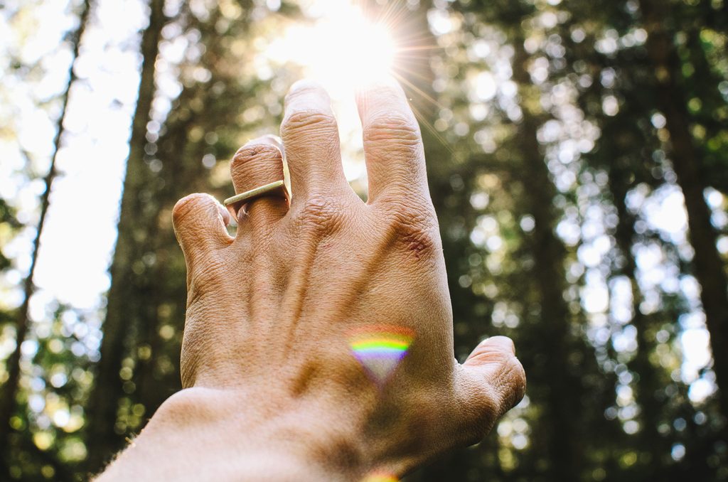 Hand reaching for the sun - why healing feels worse before it gets better